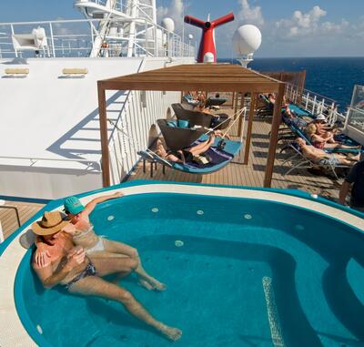 Adults enjoying pool on Carnival