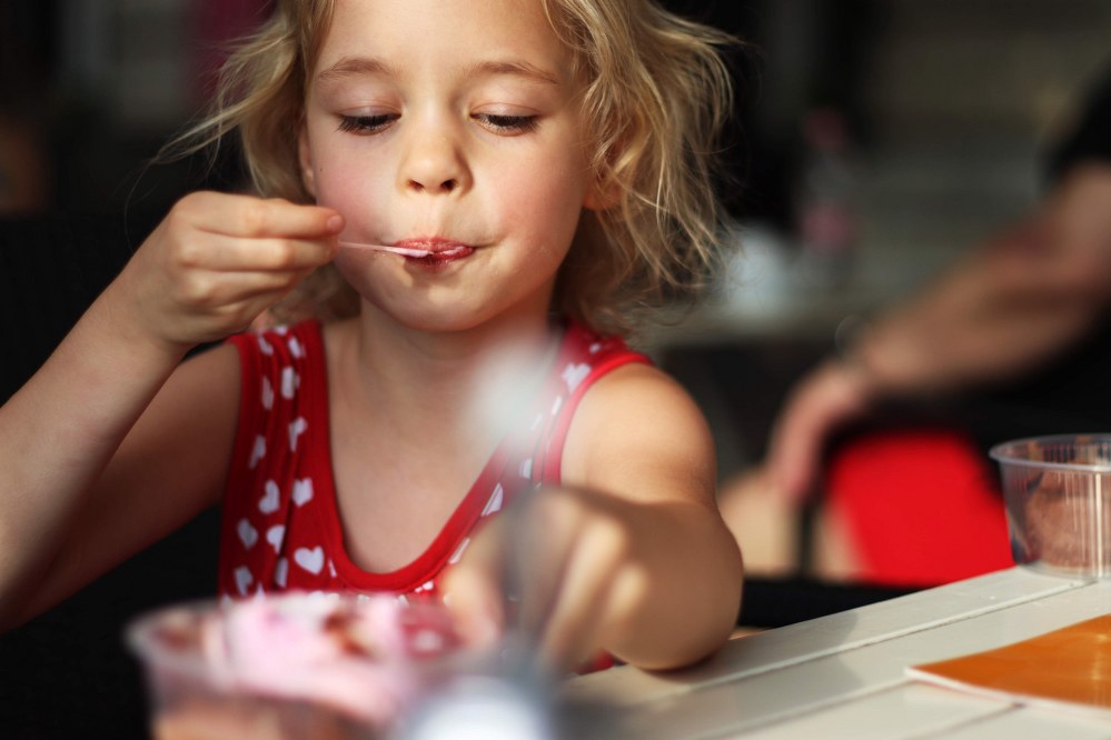 girl eating in kids friendly restaurant