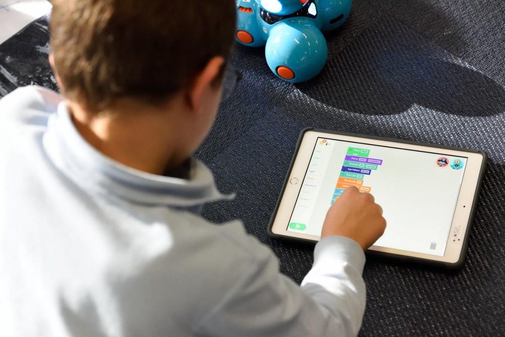 boy at tablet - best free online activities during lockdown