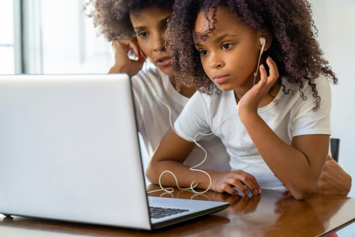 mother and daughter at laptop