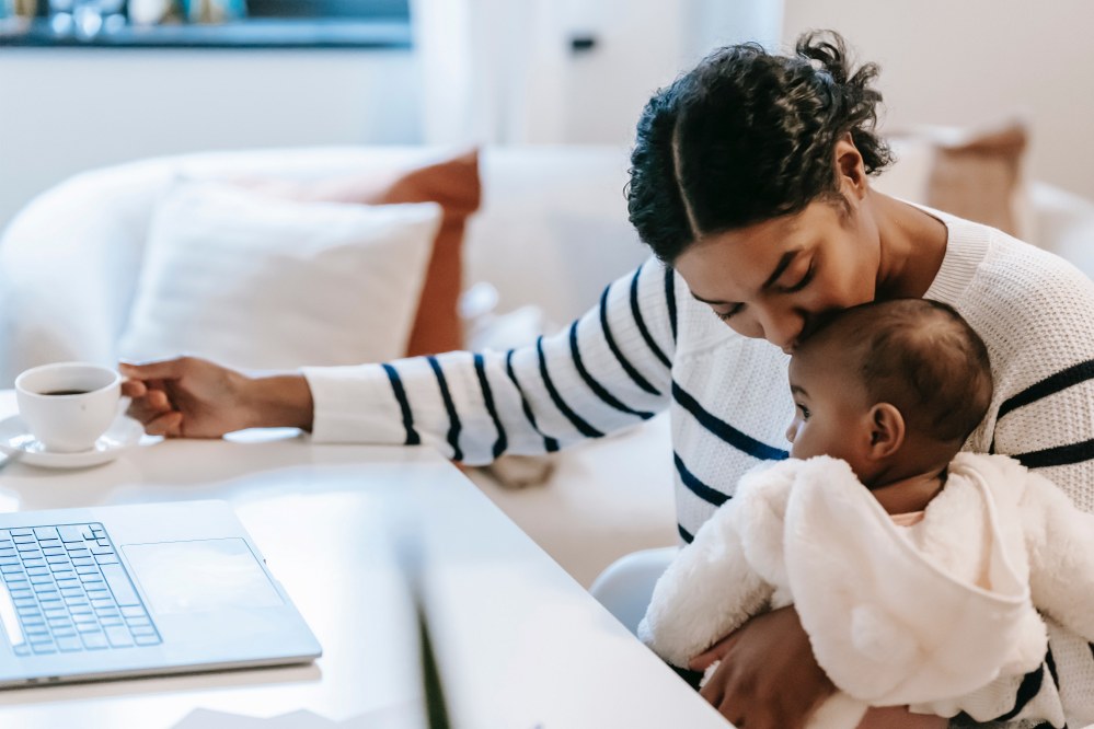 mum with baby at laptop
