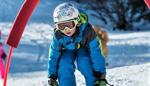 single boy racing on ski holiday in Kitzbühel Austria