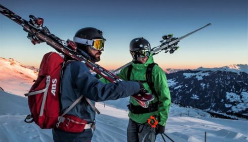 skiers in sunset