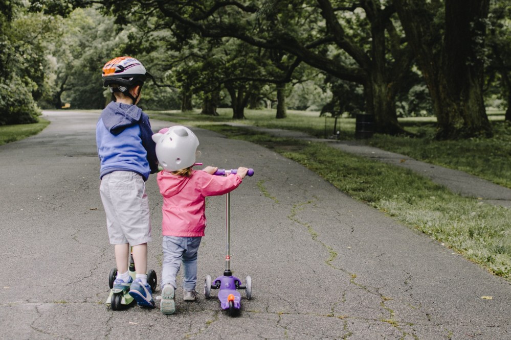 young children with kids scooters